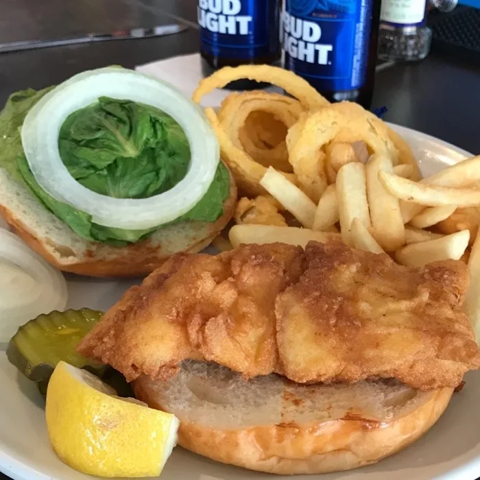 Fried fish sandwich with onion rings